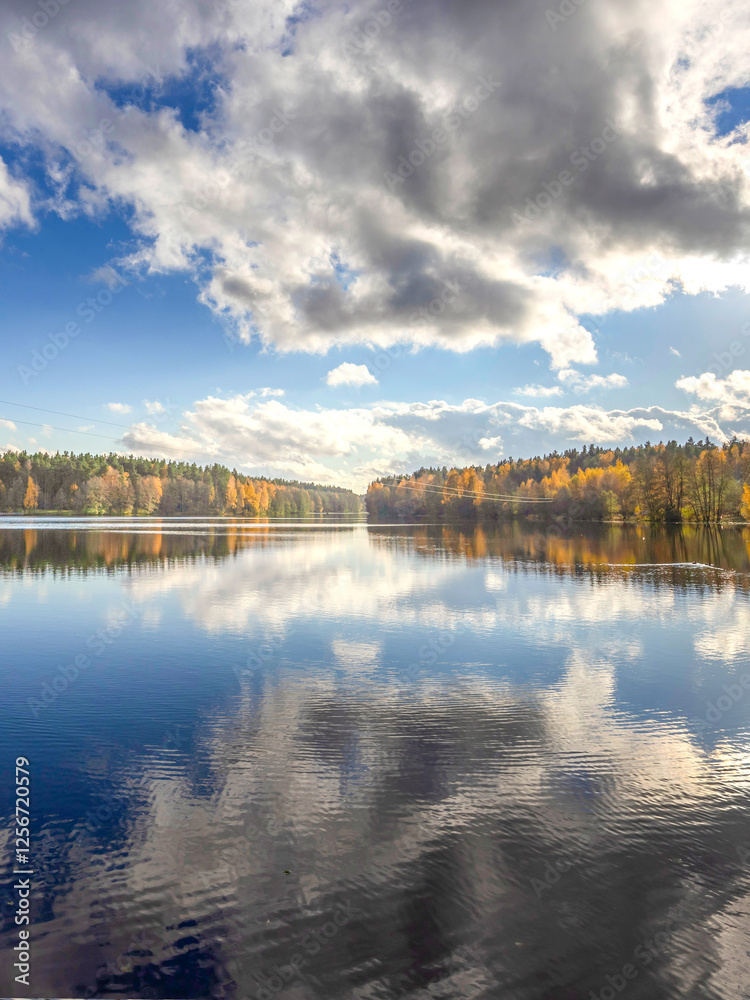 Fototapeta premium Lake with a cloudy sky in the background