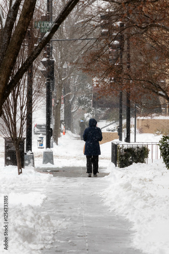 People Crossing a Snow Covered Street in DC photo