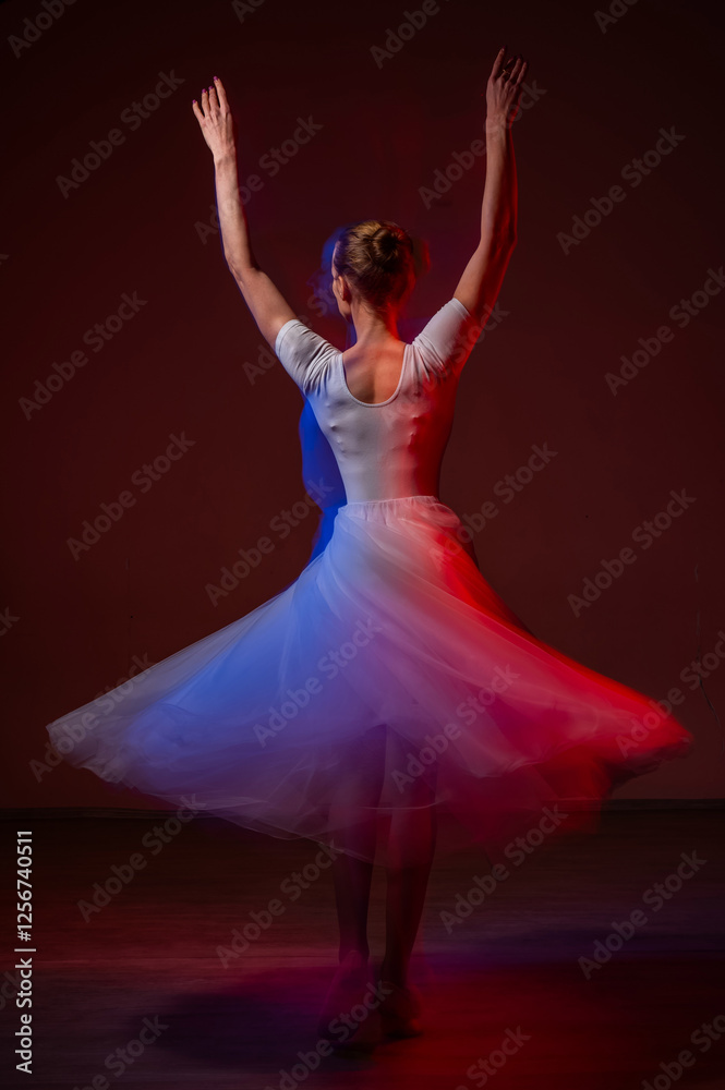 Fototapeta premium Caucasian woman dancing classical dance in tutu . Long exposure photo.