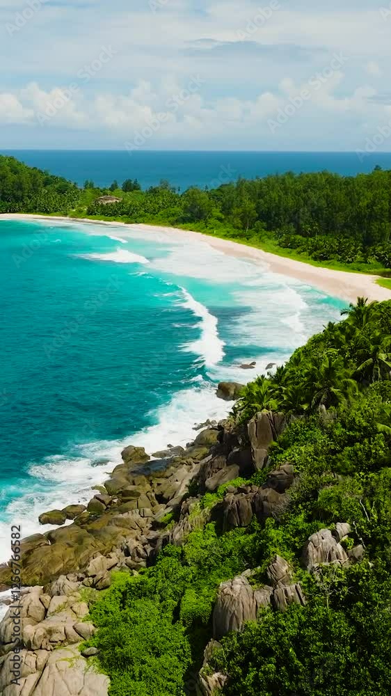 Clear azure waters meet a white sandy beach surrounded by lush greenery. Seychelles, Mahe. Police Bay. Clear azure waters meet a white sandy beach surrounded by lush greenery. Seychelles, Mahe. Police Bay.
