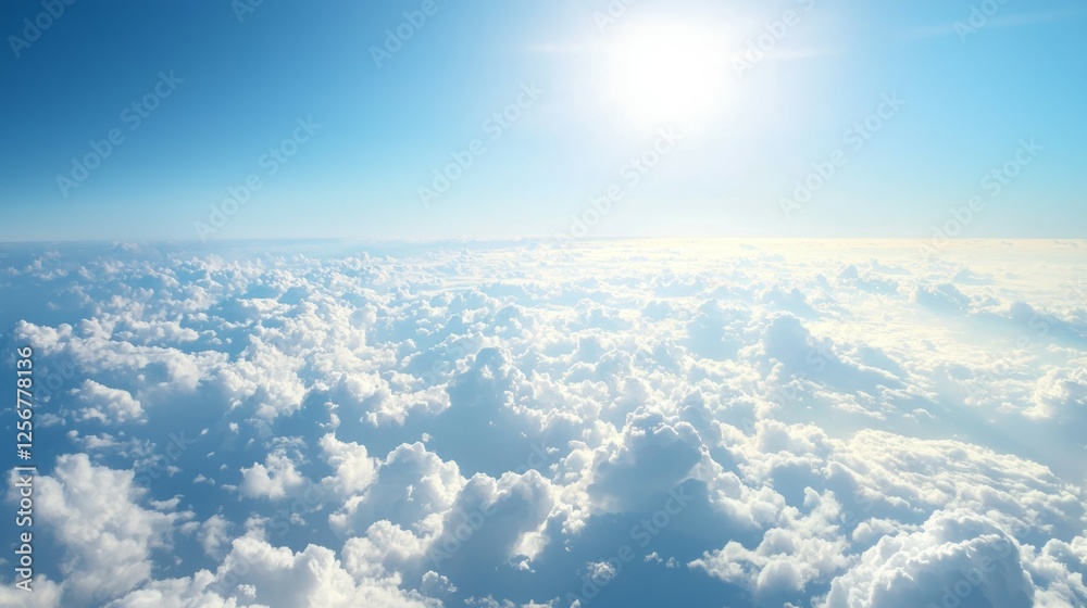 Bright Blue Sky and Soft White Clouds Under Radiant Sunlight Bright Blue Sky and Soft White Clouds Under Radiant Sunlight