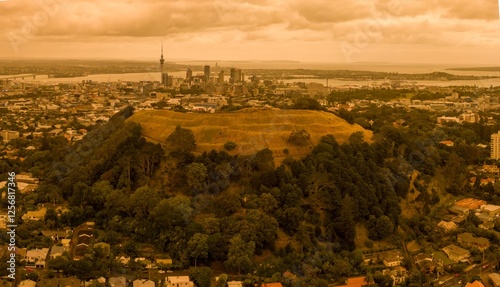 Mt Eden skyline and hazy cloudy orange sky from the Austrialia wildfires of 2020.  Auckland, New Zealand photo