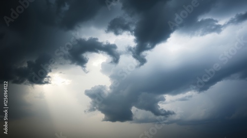 Dramatic Stormy Sky with Ominous Clouds and Rays of Sunlight

