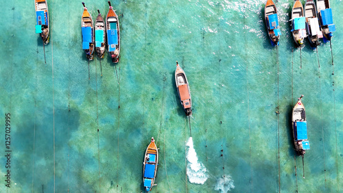 Top down drone photo of the long boats in Phi Phi Don, Thailand