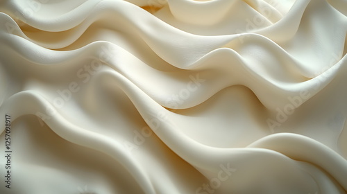 Soft white fabric draped elegantly, creating smooth waves and gentle folds illuminated by soft light.