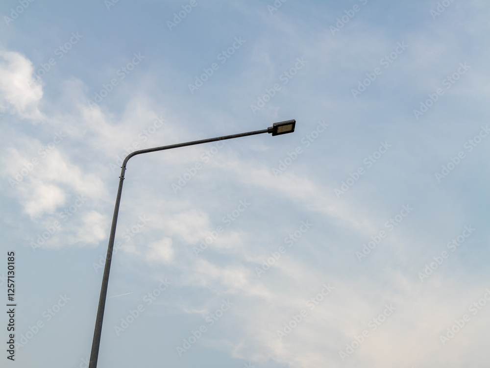 Street light illuminating the sky urban area evening perspective urban infrastructure Street light illuminating the sky urban area evening perspective urban infrastructure