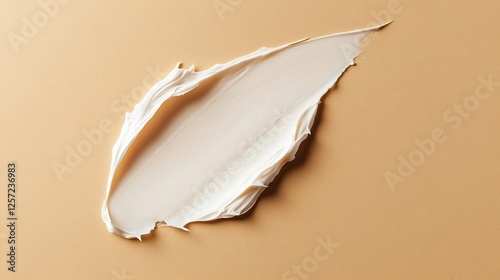 Sample of face cream on beige background, top view