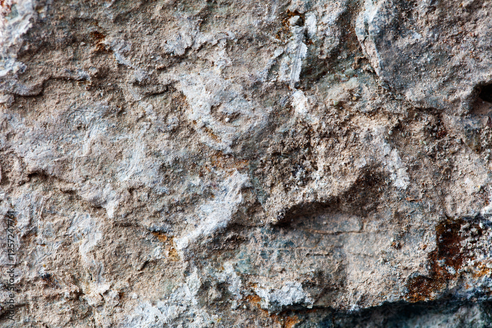 A rock with a lot of dirt and grime on it A rock with a lot of dirt and grime on it