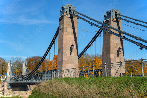 Fragment of an old metal chain bridge. Ostrov city, Pskov region, Russia