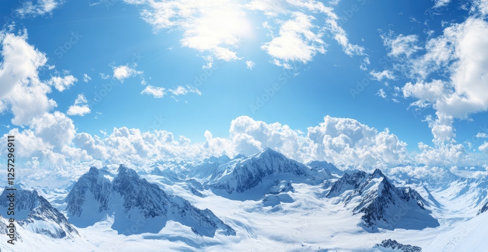 Snowy mountain range panorama, sunny sky, clouds, winter, travel Snowy mountain range panorama, sunny sky, clouds, winter, travel