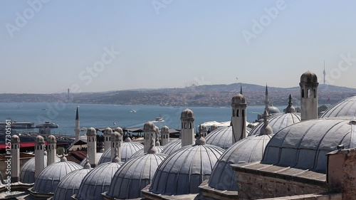 Turkish bath's domes and flues and Istanbul view from Suleymaniye Mosque. Istanbul, Turkey.