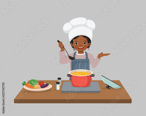 Cute little African girl chef cooking delicious vegetable soup with hand showing for copy space
