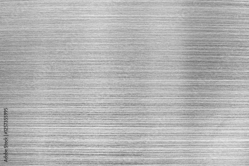 Monochrome texture of shiny scratched metal. Abstract background. photo