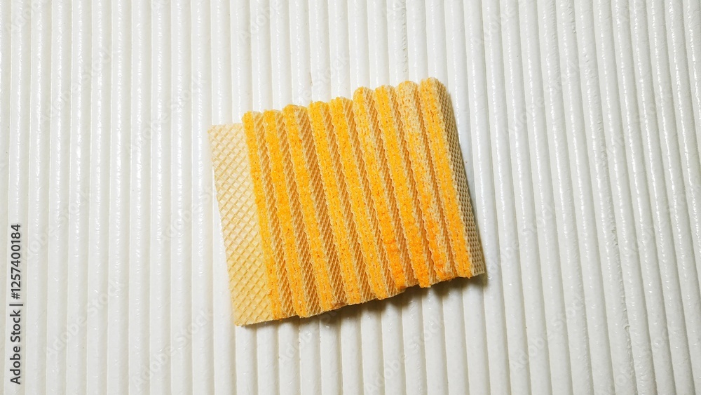 stacked layered wafers, with cheese paste, on an isolated white background
