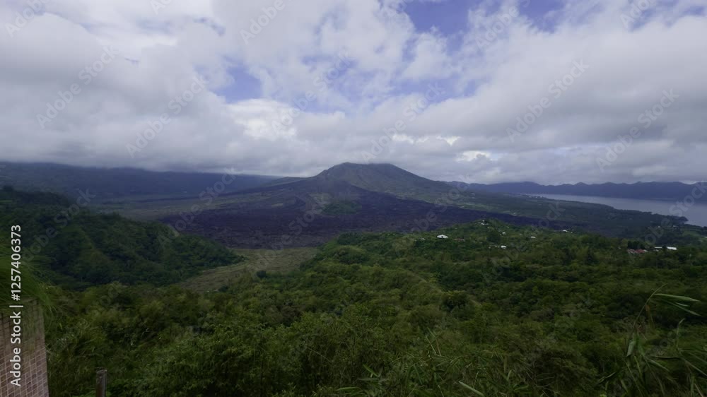 Iconic Mount Batur in Tropical Bali
A stunning view of Mount Batur volcano surrounded by tropical nature and volcanic plains. Iconic Mount Batur in Tropical Bali
A stunning view of Mount Batur volcano surrounded by tropical nature and volcanic plains.