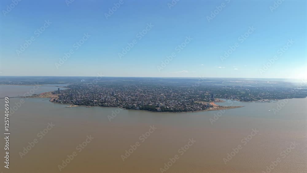 Discover Posadas, the capital of Misiones Province in northeastern Argentina, through a stunning panoramic aerial view bordered by the Paraná River. Discover Posadas, the capital of Misiones Province in northeastern Argentina, through a stunning panoramic aerial view bordered by the Paraná River.