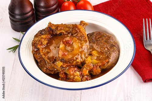 Italian cuisine - ossobuco with sauce