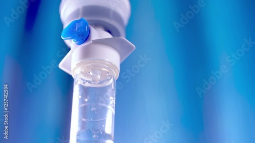  IV drip with dropper bottle on medical equipment, Focus on intravenous saline injection close-up in hospital,