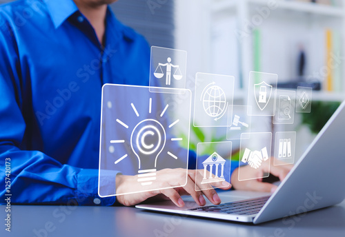Copyright and intellectual property protection concept. Man using laptop with digital icons representing copyright, intellectual property, legal protection, innovation rights, and data security.