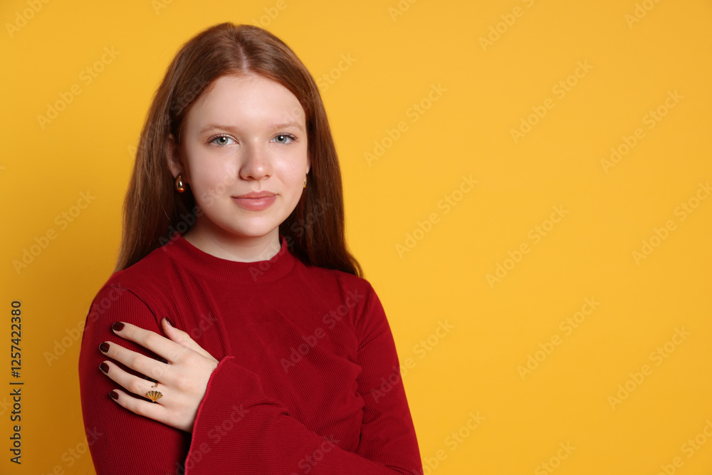 Fototapeta premium Teenage girl wearing stylish jewellery on yellow background, space for text