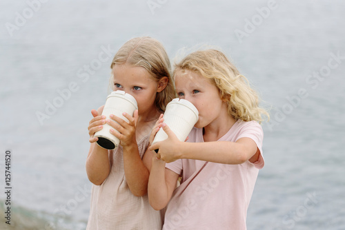 Girls enjoying drinks at sea photo