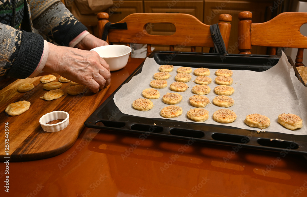 Preparing traditional baked goods in a cozy kitchen during the evening