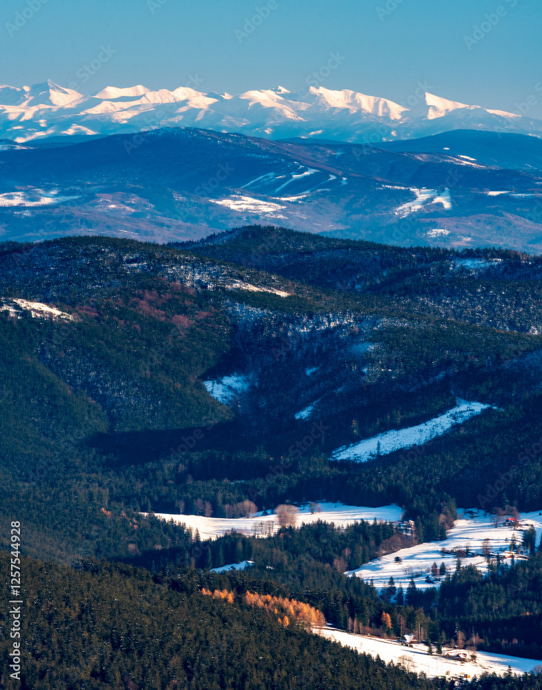 Obraz premium Krivan in High Tatras and Western Tatras mountains from Lysa hora hill in winter Moravskoslezske Beskydy mountains in Czech republic