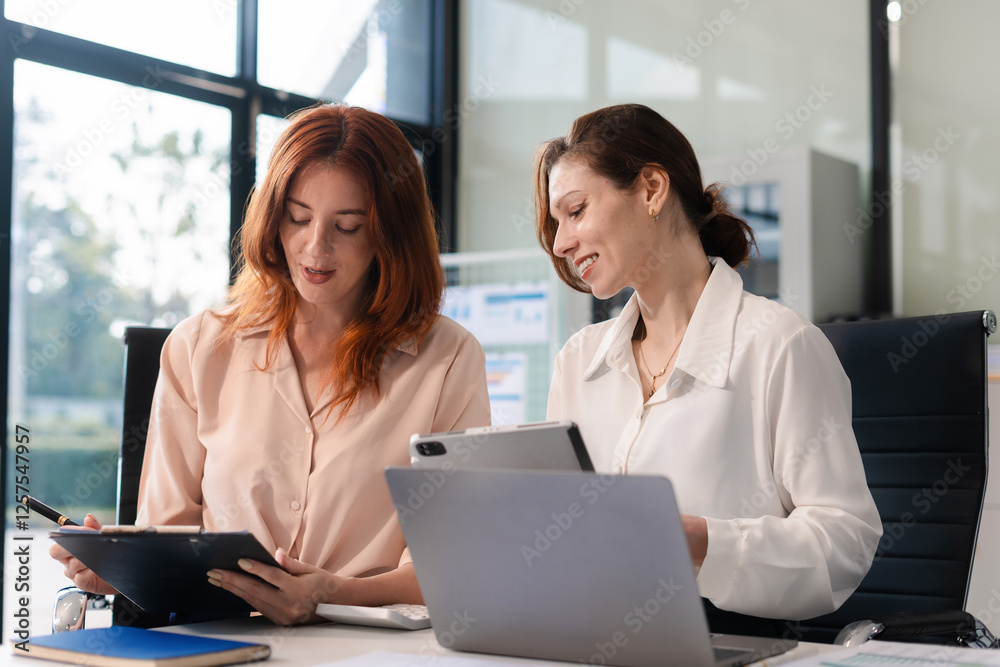 Diverse professionals collaborate on project analysis with financial graphs. Diverse professionals collaborate on project analysis with financial graphs.
