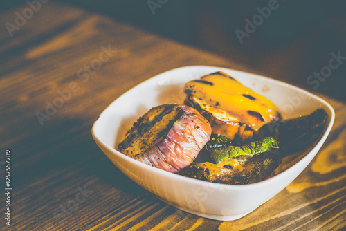 grilled eggplant, zuchini,bell peppers served in a whte bowl