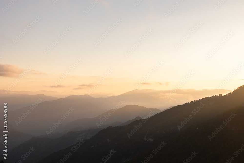 Landscape of the mountain range at sunset. Hazy mountains Landscape of the mountain range at sunset. Hazy mountains