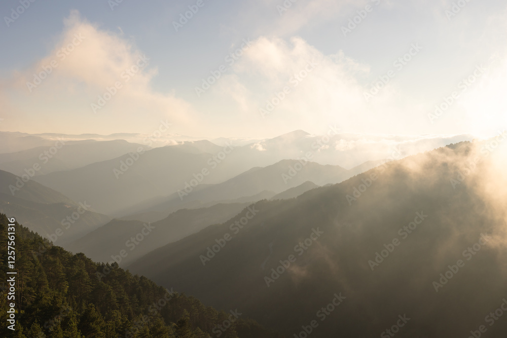 Landscape of the mountain range at sunset with haze Landscape of the mountain range at sunset with haze