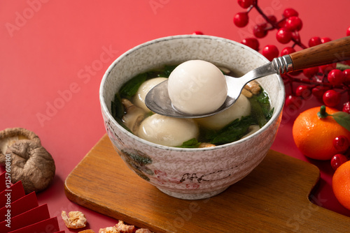 Big tangyuan, yuanxiao with savory soup for traditional lunar festival. photo