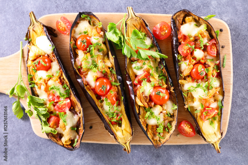 baked eggplant stuffed with tomato, cheese and herbs