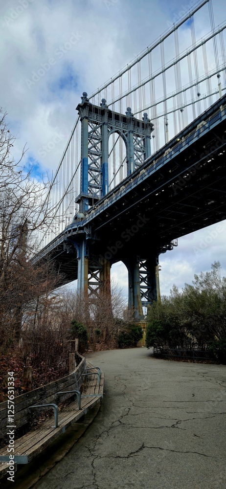 Manhattan Bridge view from a park pathway. Manhattan Bridge view from a park pathway.
