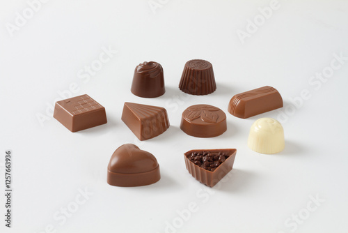Chocolate bonbons on white background