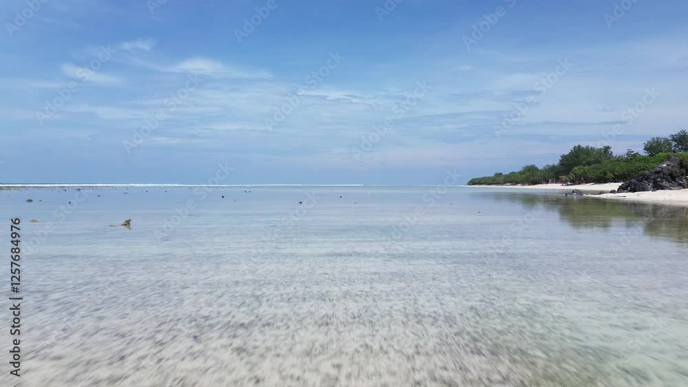 Aerial Drone view of Gili Trawangan's stunning Island. Crystal-clear Turquoise Water with White Sand Beach on vibrant Island Scenery.
Tropical Paradise Drone Nature Landscape in Asia. Aerial Drone view of Gili Trawangan's stunning Island. Crystal-clear Turquoise Water with White Sand Beach on vibrant Island Scenery.
Tropical Paradise Drone Nature Landscape in Asia.