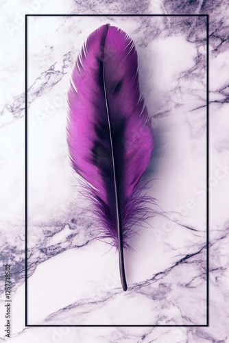 purpel feather on a marble background with a black frame photo