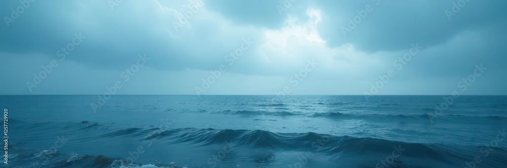 Fototapeta premium Overcast sky, deep blue sea Muted light, gentle waves , vast, reflection