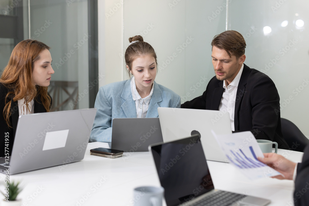 Colleagues collaborating on a project in a modern office Colleagues collaborating on a project in a modern office