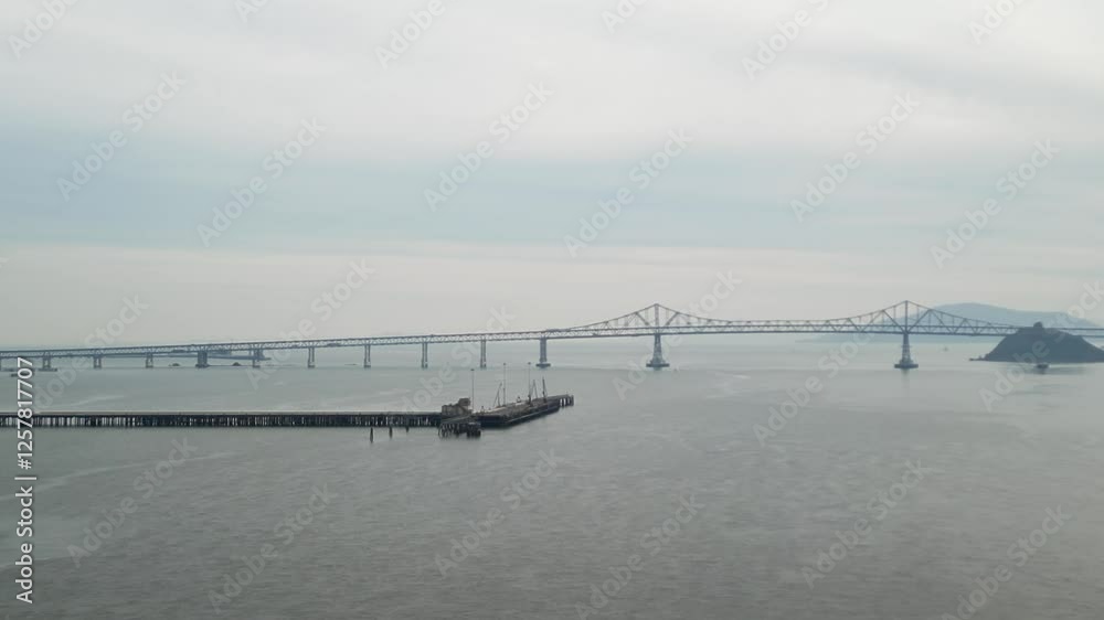 An aerial drone view of the Richmond–San Rafael Bridge from above Point Molate Beach’s coastline. An aerial drone view of the Richmond–San Rafael Bridge from above Point Molate Beach’s coastline.
