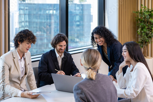 African woman sale manager is showing annual report chart to her colleagues in the executive meeting for next year plan with market share increase for global business and investment concept