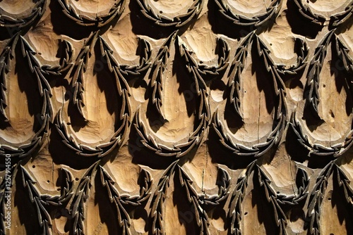 background with reliefs in antique wood with woodworm holes