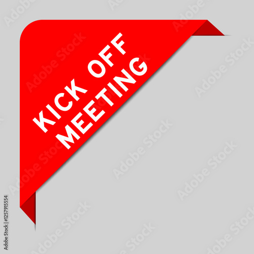 Red color of corner label banner with word kick off meeting on gray background