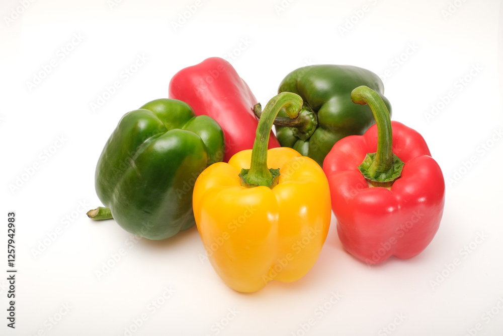 Red, yellow and green peppers on white background Red, yellow and green peppers on white background