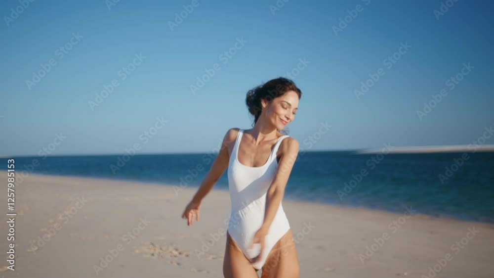 Serene girl spinning ocean shore enjoying carefree summer weekend. Happy woman Serene girl spinning ocean shore enjoying carefree summer weekend. Happy woman