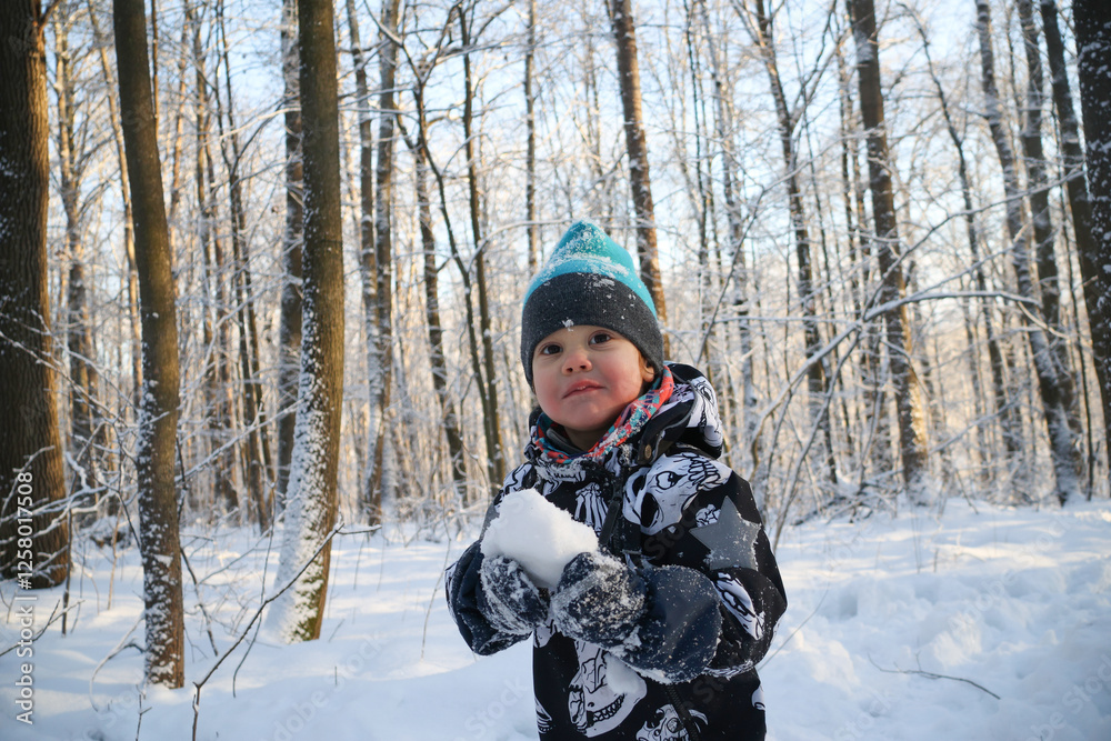 little boy in winter park