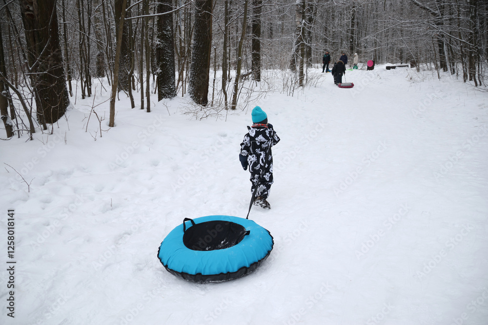 little boy in winter park