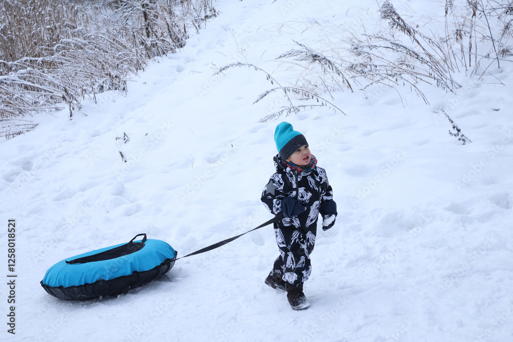 little boy in winter park