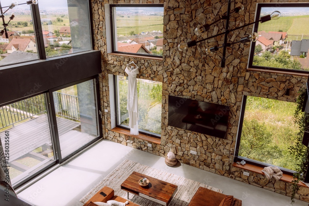 Fototapeta premium Modern living room with scenic suburban view.