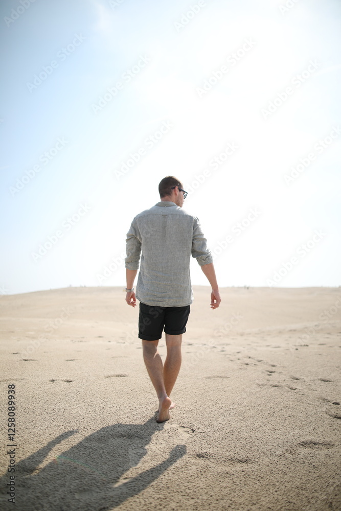 Young man in desert landscape Young man in desert landscape